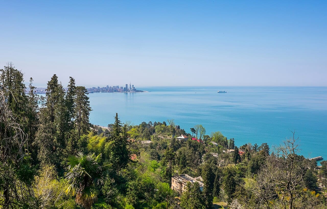 Black Sea shoreline with the Batumi skyline in the distance.