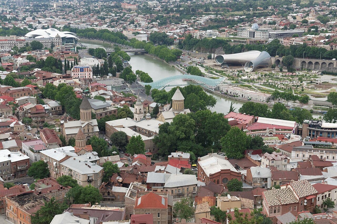 Old Tbilisi buildings and the Mtkvari River, seen from above.